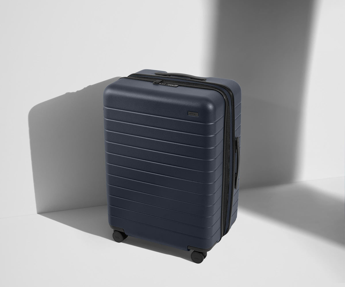 The Medium Flex in Navy Blue by Away — brand photography